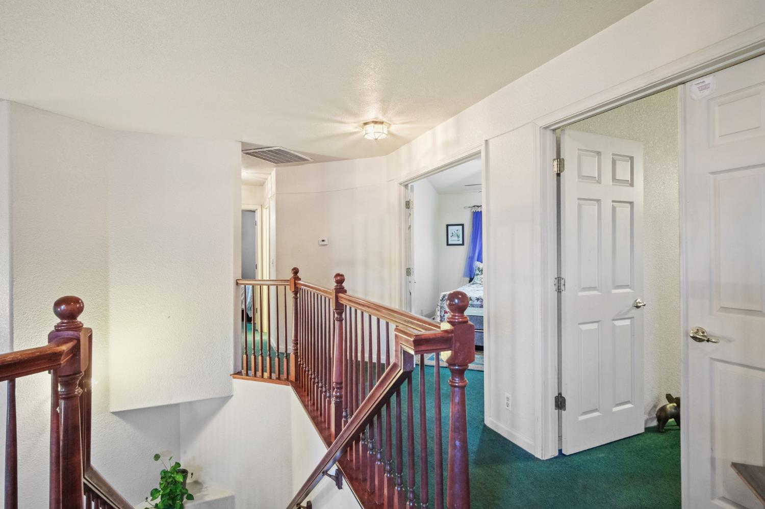 2805 Medinah Way Modesto, CA 95355 - Photo 20 of 39 a view of a hallway with a white walls and stairs