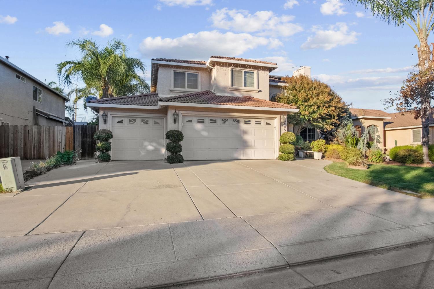 2805 Medinah Way Modesto, CA 95355 - Photo 3 of 39 a view of a white house with a yard