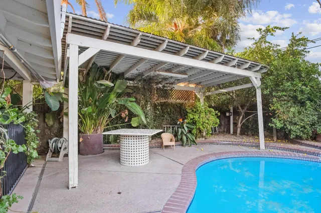 a view of a two chairs in the patio