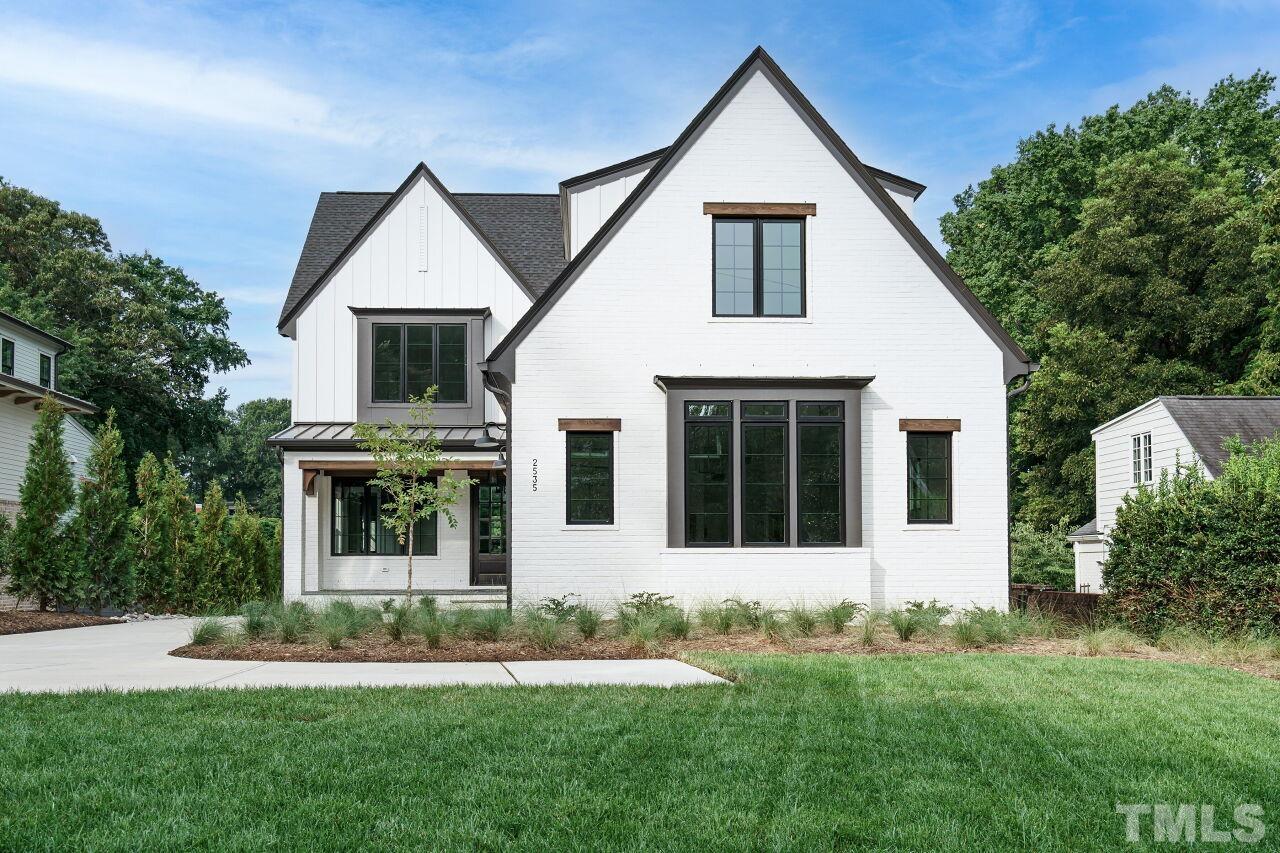2535 Wake Drive Raleigh, NC 27608 - Photo 2 of 51 front view of a house and a yard