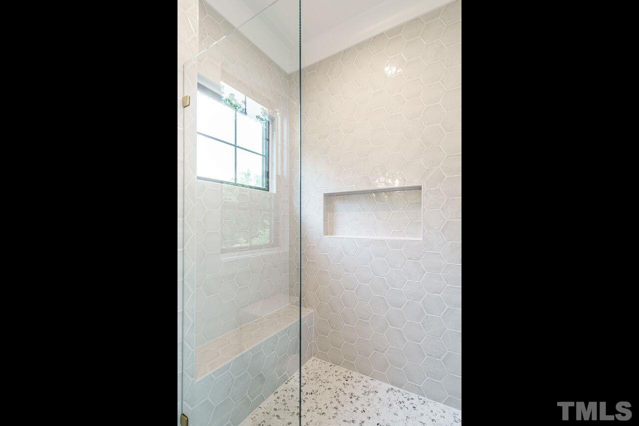 2535 Wake Drive Raleigh, NC 27608 - Photo 25 of 51 a picture of a bathroom with a glass shower door