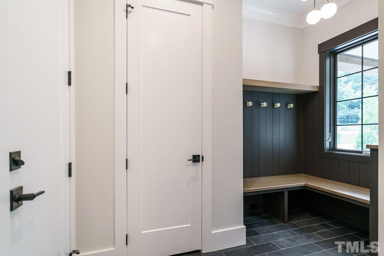 2535 Wake Drive Raleigh, NC 27608 - Photo 27 of 51 a bathroom with a bathtub and window