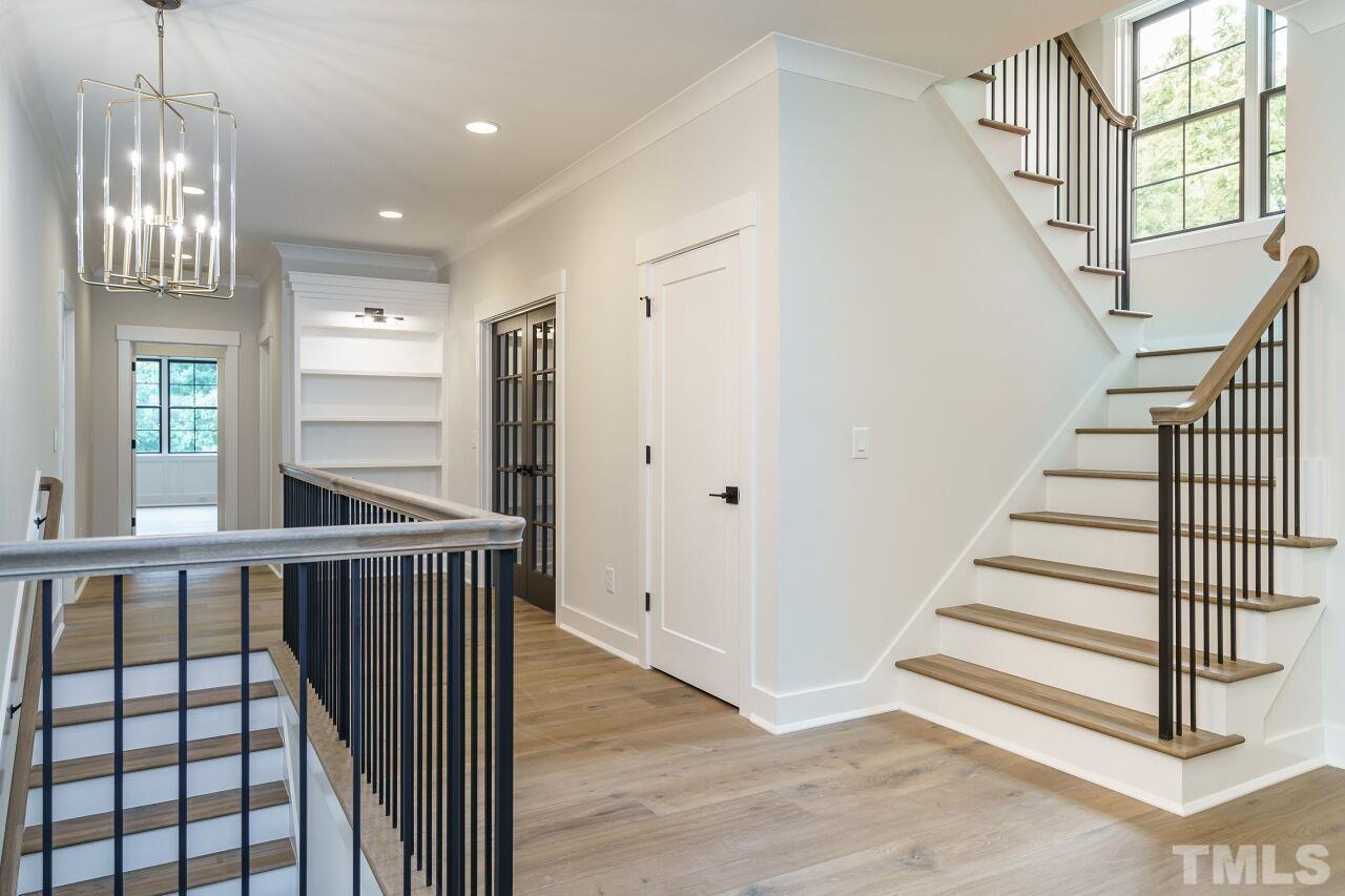 2535 Wake Drive Raleigh, NC 27608 - Photo 29 of 51 a view of entryway and hall with wooden floor