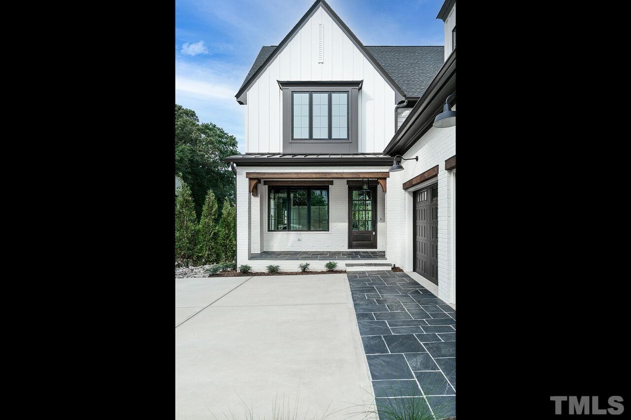 2535 Wake Drive Raleigh, NC 27608 - Photo 3 of 51 a view of a house with a porch