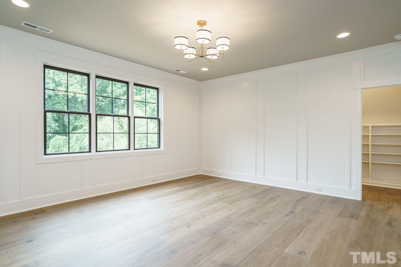 2535 Wake Drive Raleigh, NC 27608 - Photo 31 of 51 wooden floor in an empty room with a window