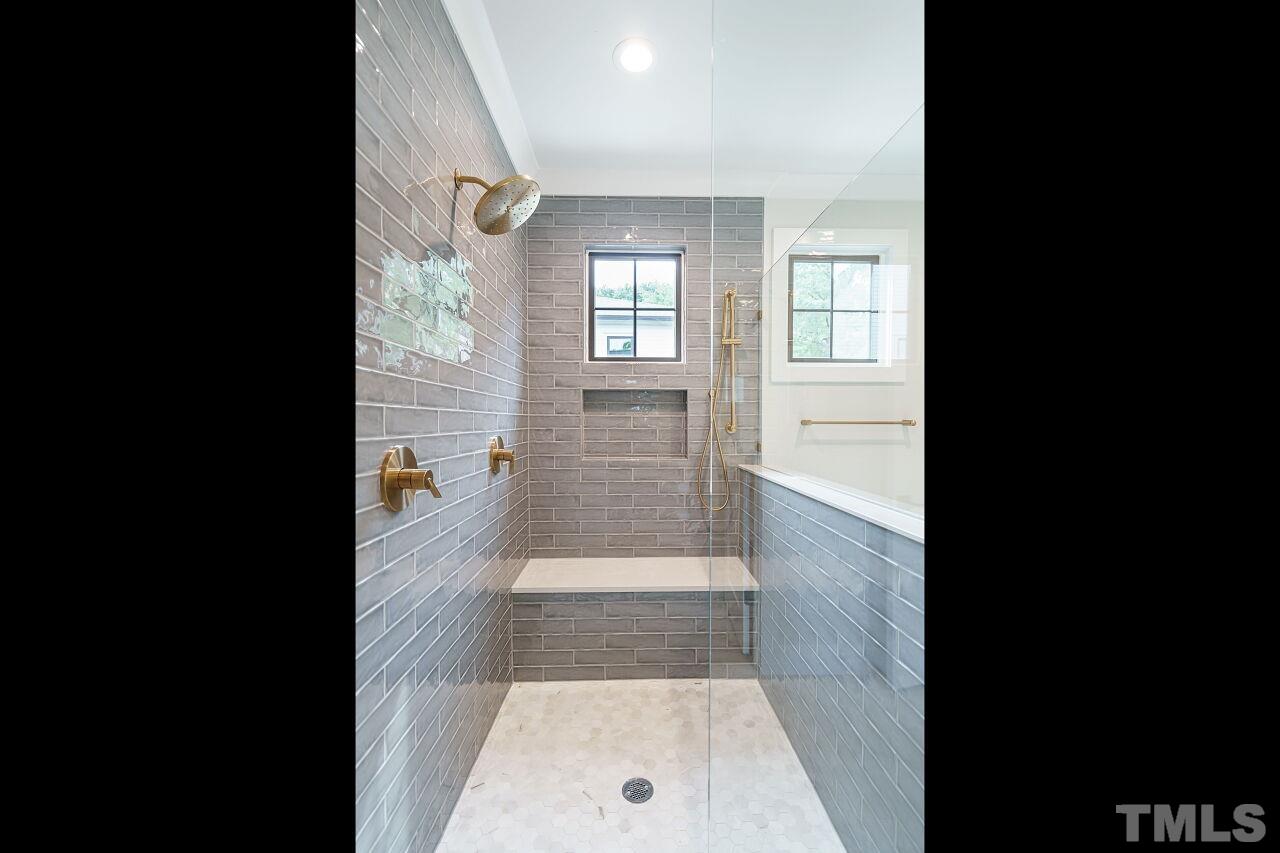 2535 Wake Drive Raleigh, NC 27608 - Photo 34 of 51 a bathroom with a glass door shower