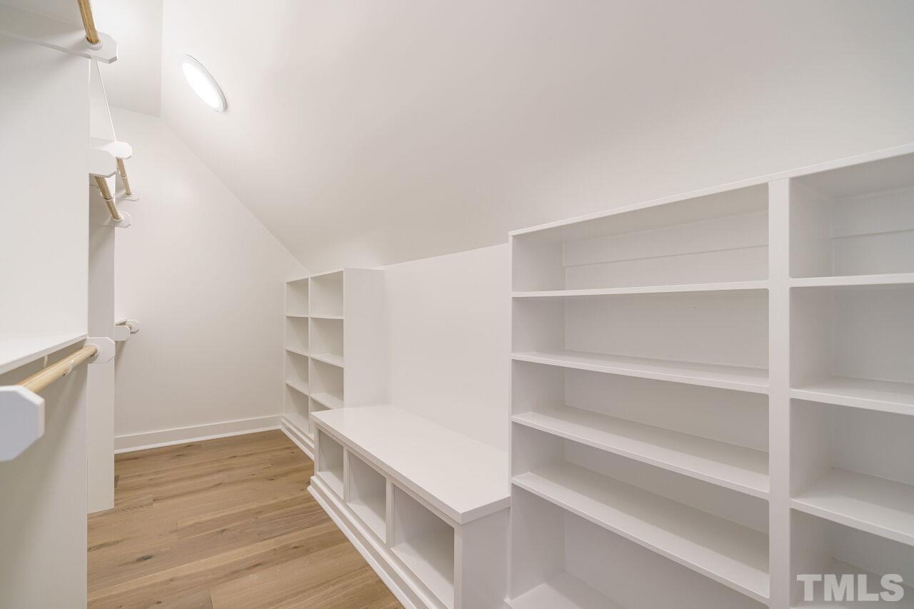 2535 Wake Drive Raleigh, NC 27608 - Photo 36 of 51 a view of walk in closet with empty racks