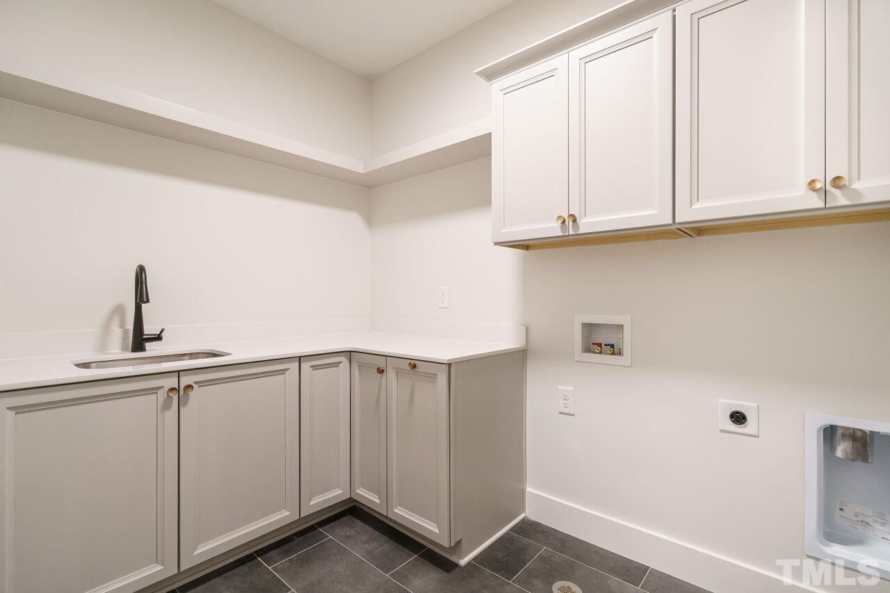 2535 Wake Drive Raleigh, NC 27608 - Photo 37 of 51 a view of cabinets and window