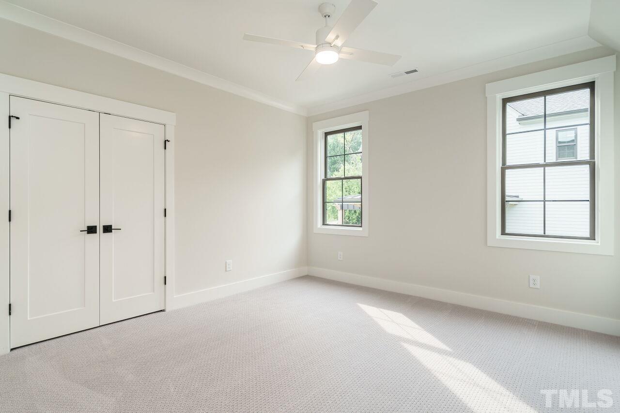 2535 Wake Drive Raleigh, NC 27608 - Photo 38 of 51 an empty room with windows and closet