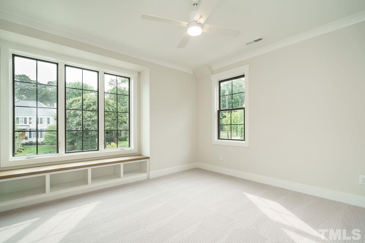 2535 Wake Drive Raleigh, NC 27608 - Photo 42 of 51 a view of room with window and ceiling fan