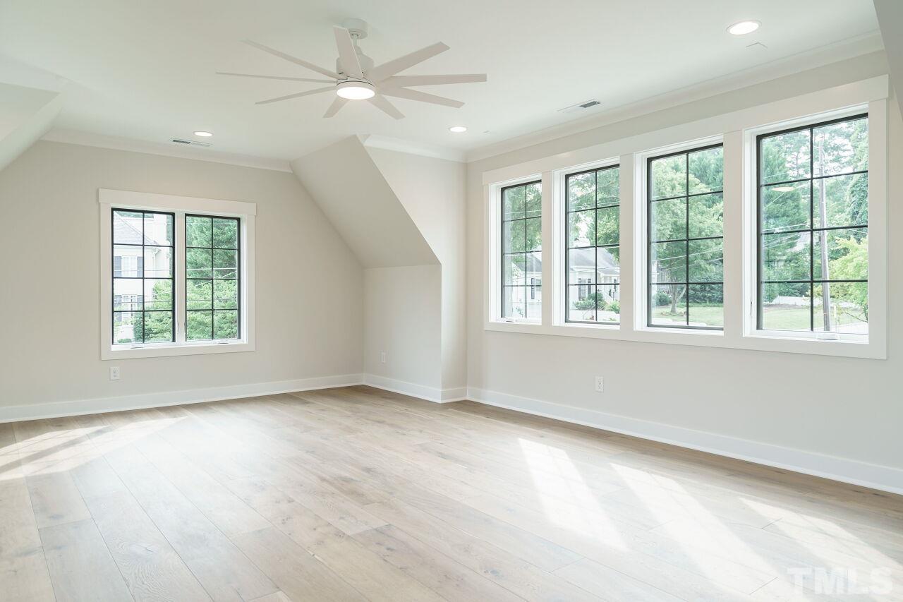 2535 Wake Drive Raleigh, NC 27608 - Photo 45 of 51 wooden floor in an empty room with a window