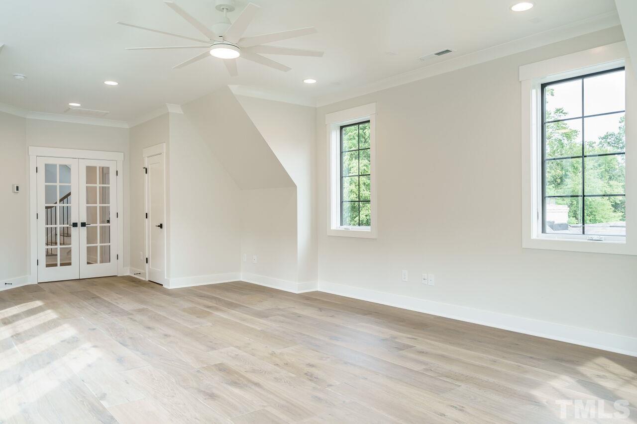 2535 Wake Drive Raleigh, NC 27608 - Photo 46 of 51 wooden floor in an empty room with a window