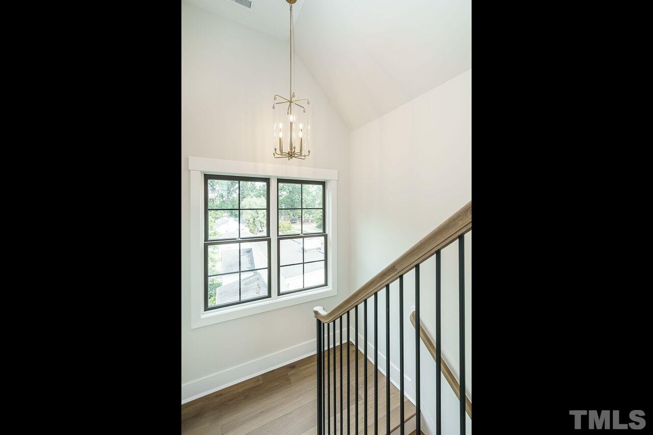 2535 Wake Drive Raleigh, NC 27608 - Photo 47 of 51 a view of a hallway with windows