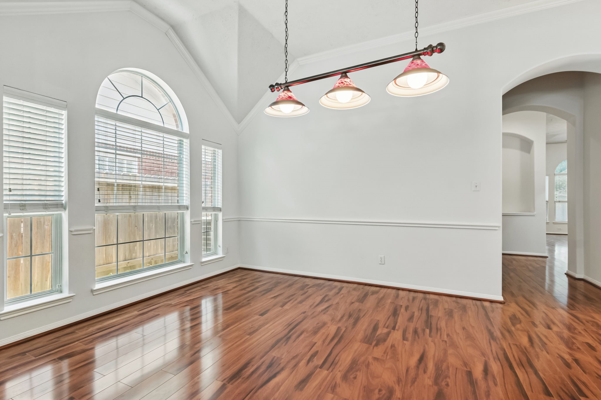 31235 Windcrest Park Lane Spring, TX 77386 - Photo 15 of 50 an empty room with wooden floor fan and windows