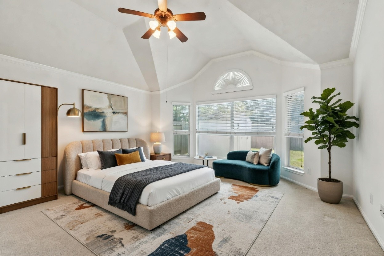 31235 Windcrest Park Lane Spring, TX 77386 - Photo 20 of 50 a bedroom with a bed a chandelier and a window