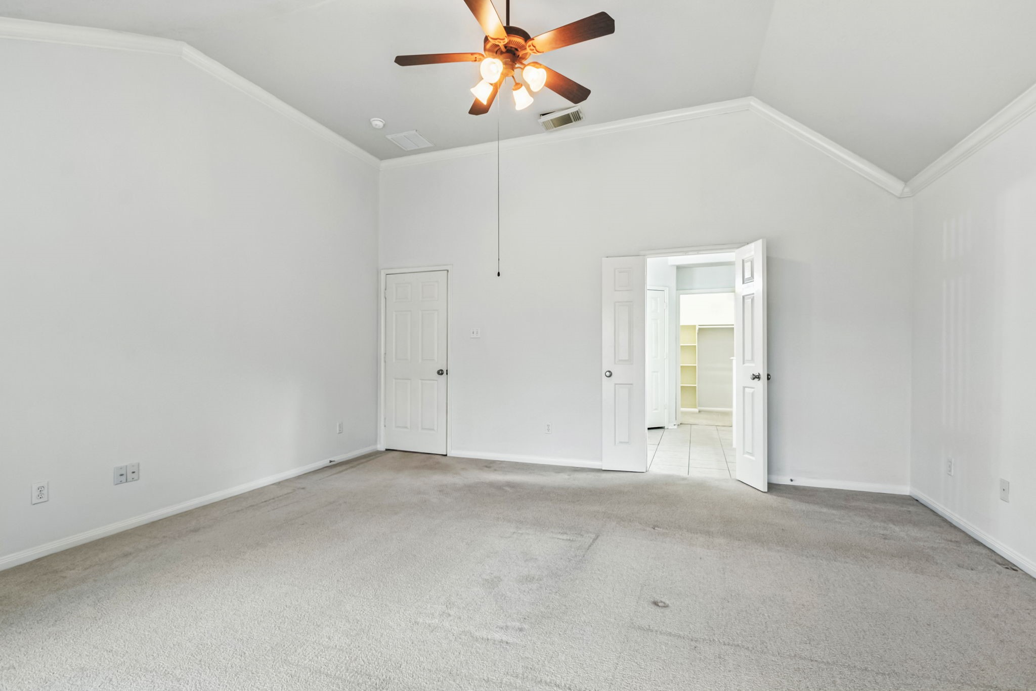 31235 Windcrest Park Lane Spring, TX 77386 - Photo 22 of 50 an empty room with closet and a chandelier fan