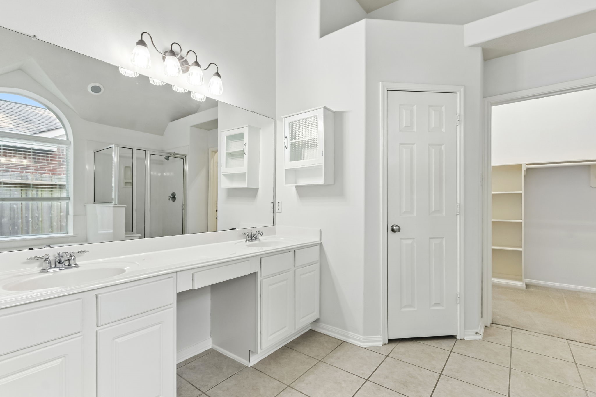 31235 Windcrest Park Lane Spring, TX 77386 - Photo 23 of 50 a spacious bathroom with a double vanity sink mirror and