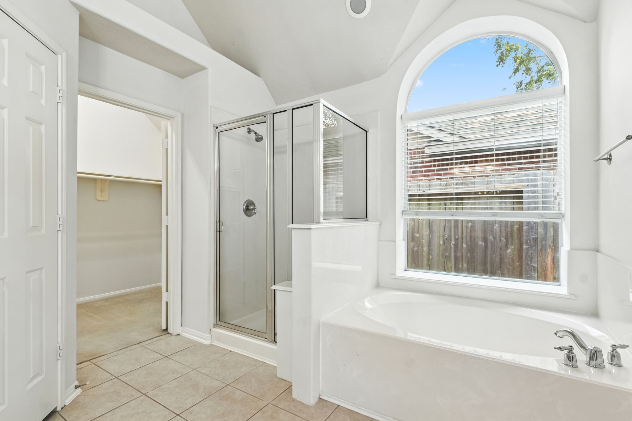 31235 Windcrest Park Lane Spring, TX 77386 - Photo 24 of 50 a bathroom with a tub and a window