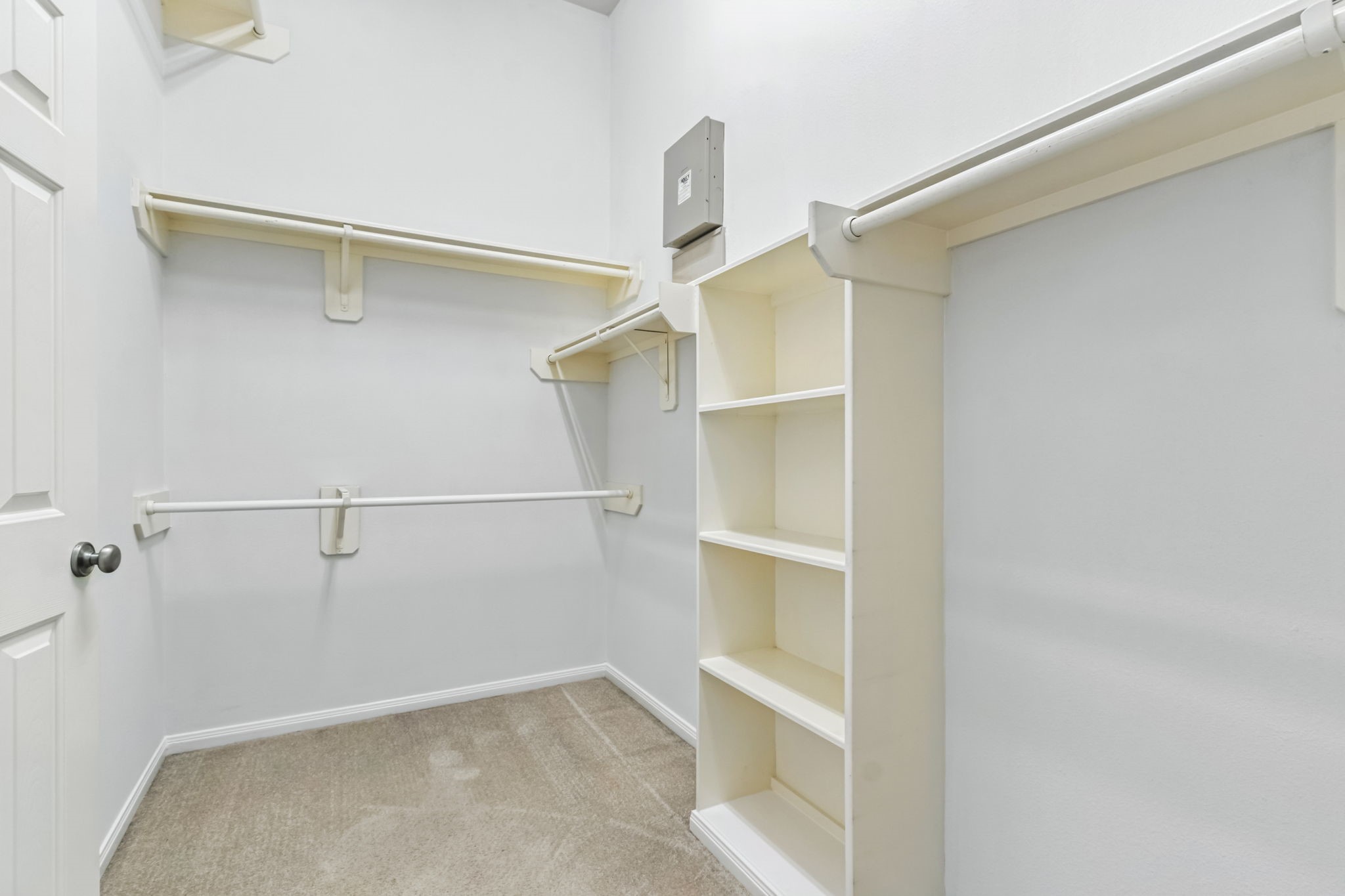 31235 Windcrest Park Lane Spring, TX 77386 - Photo 25 of 50 a view of walk in closet with empty racks