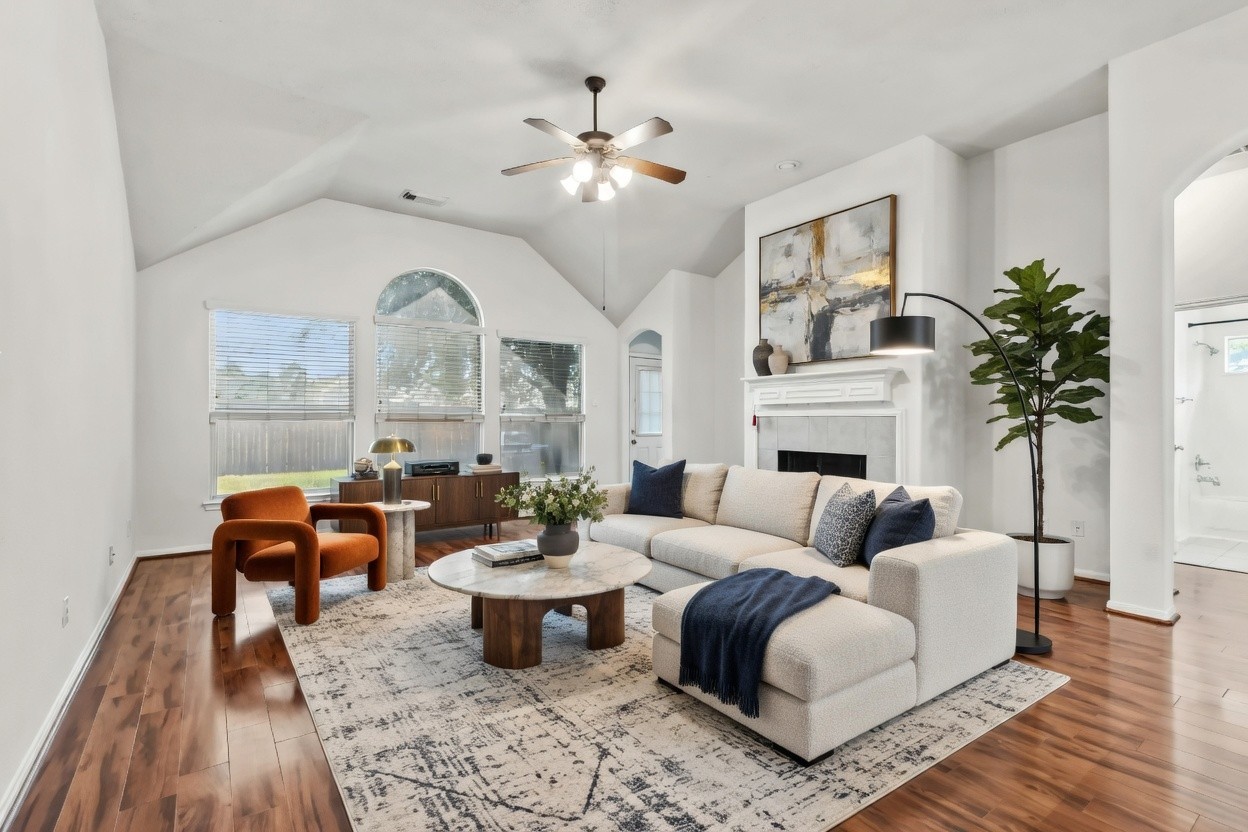 31235 Windcrest Park Lane Spring, TX 77386 - Photo 3 of 50 a living room with furniture and a fireplace