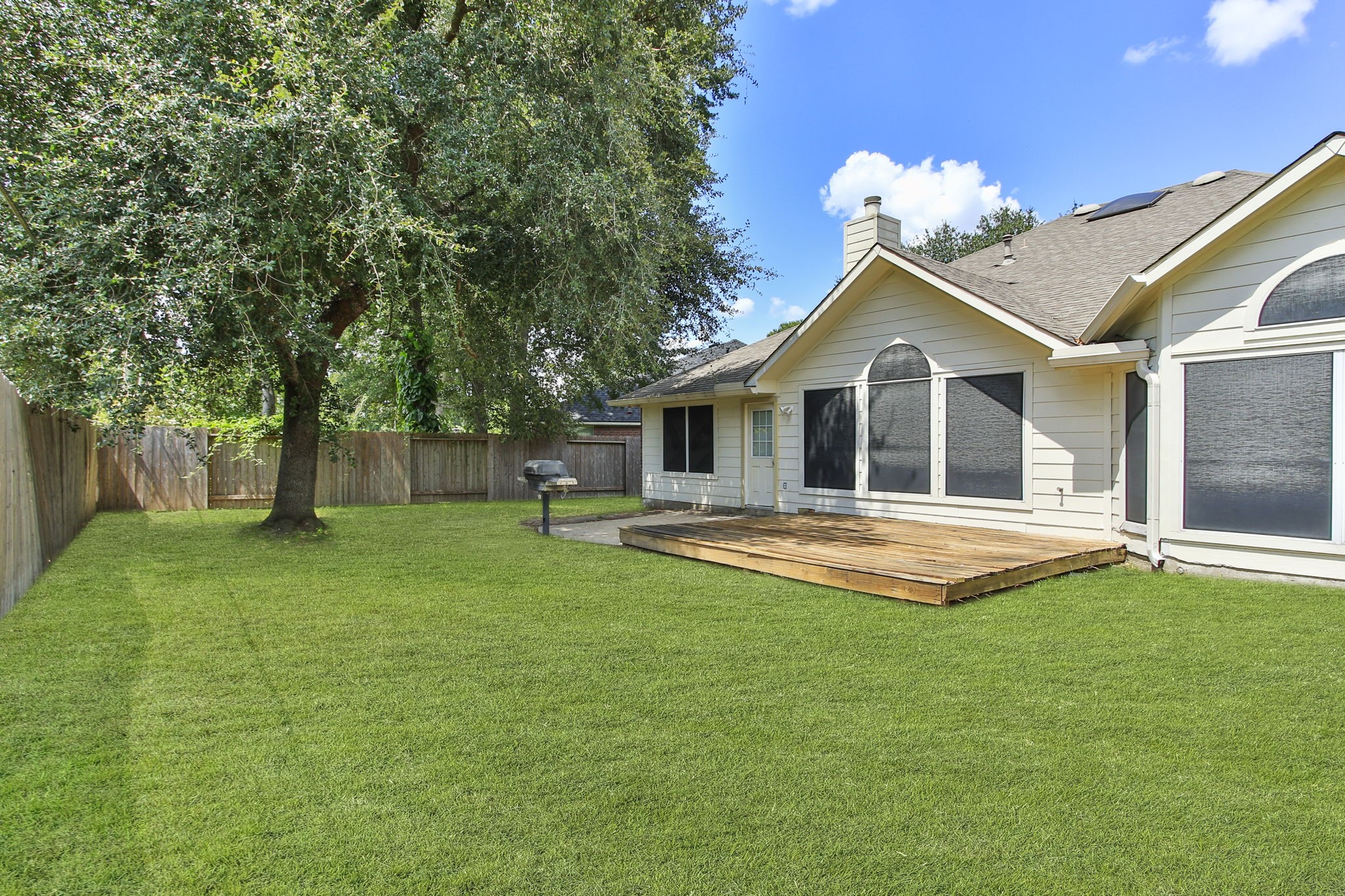 31235 Windcrest Park Lane Spring, TX 77386 - Photo 34 of 50 a front view of a house with a garden and yard