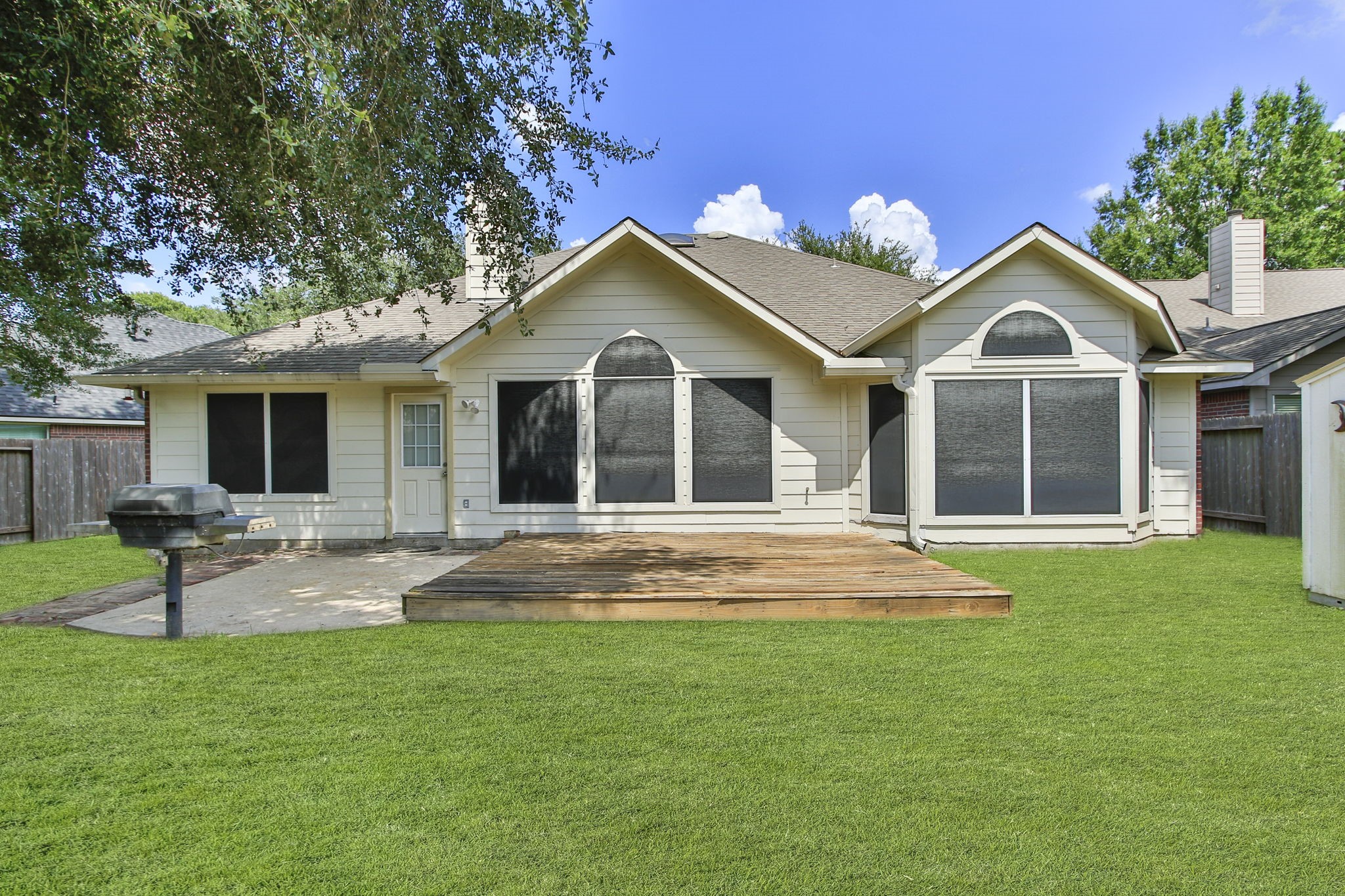 31235 Windcrest Park Lane Spring, TX 77386 - Photo 36 of 50 a front view of a house with a garden and yard