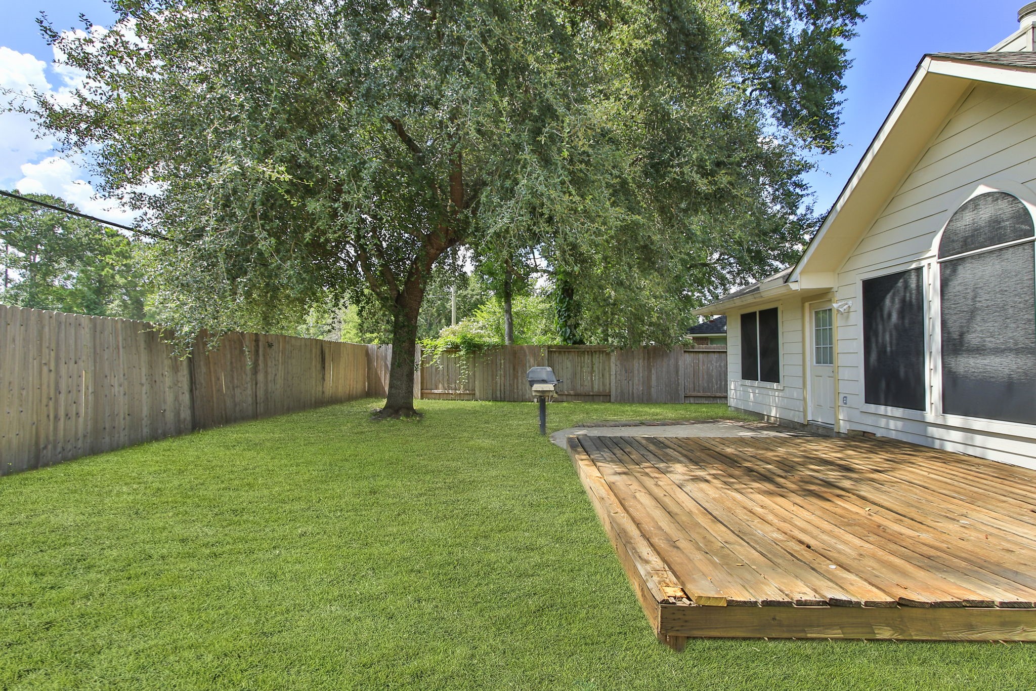 31235 Windcrest Park Lane Spring, TX 77386 - Photo 37 of 50 a view of a backyard with tree s