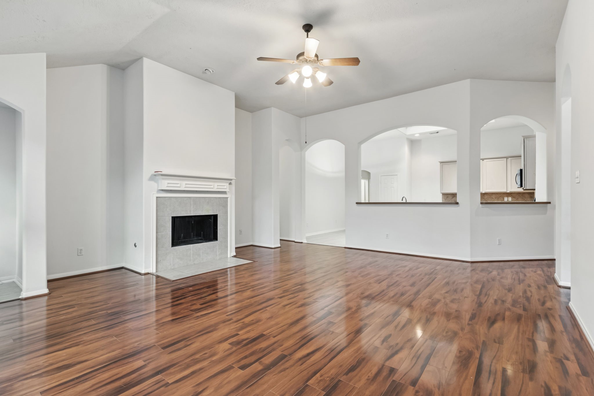 31235 Windcrest Park Lane Spring, TX 77386 - Photo 4 of 50 a view of a livingroom with wooden floor