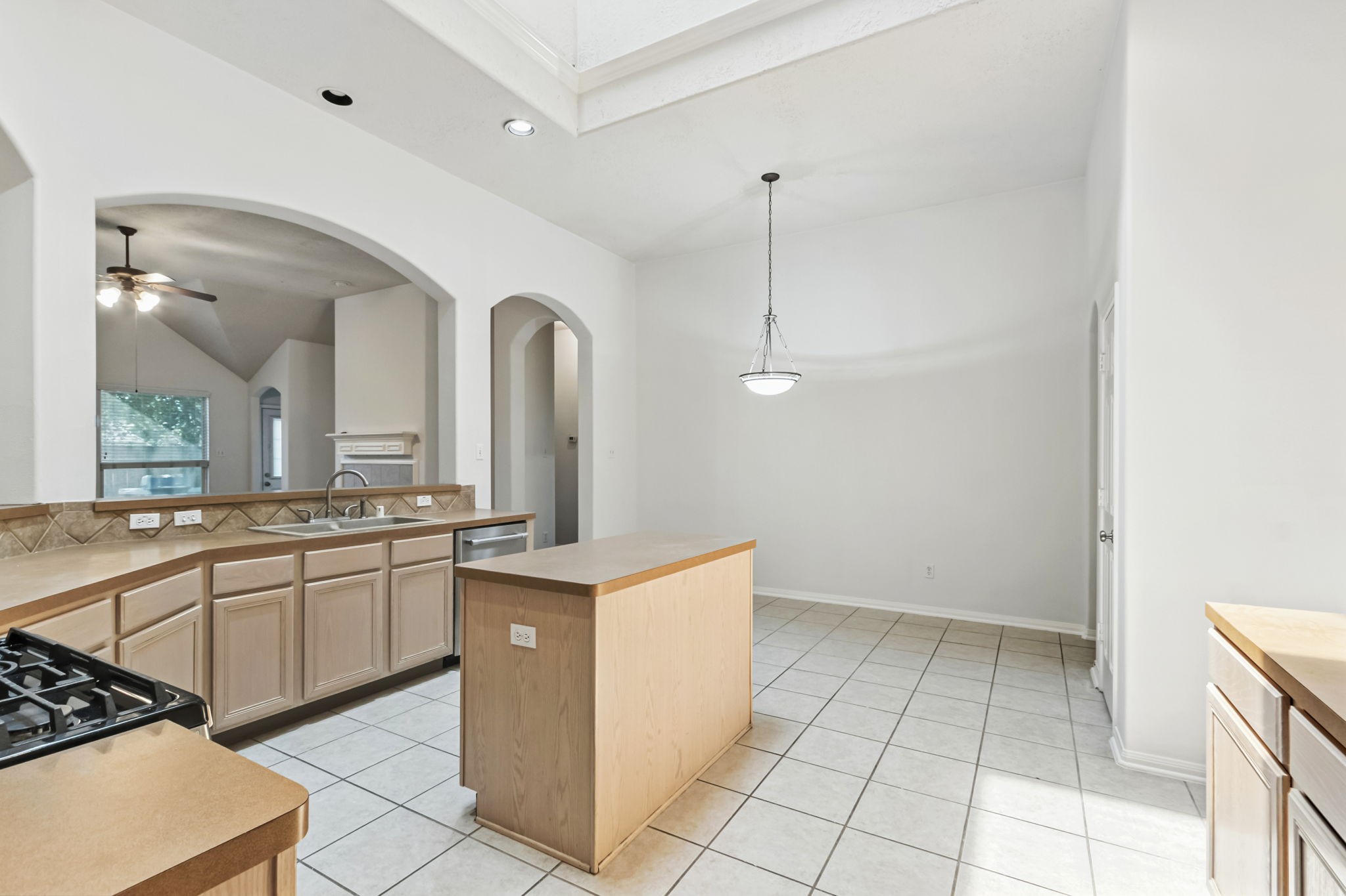 31235 Windcrest Park Lane Spring, TX 77386 - Photo 10 of 50 a kitchen with stainless steel appliances a sink stove and cabinets