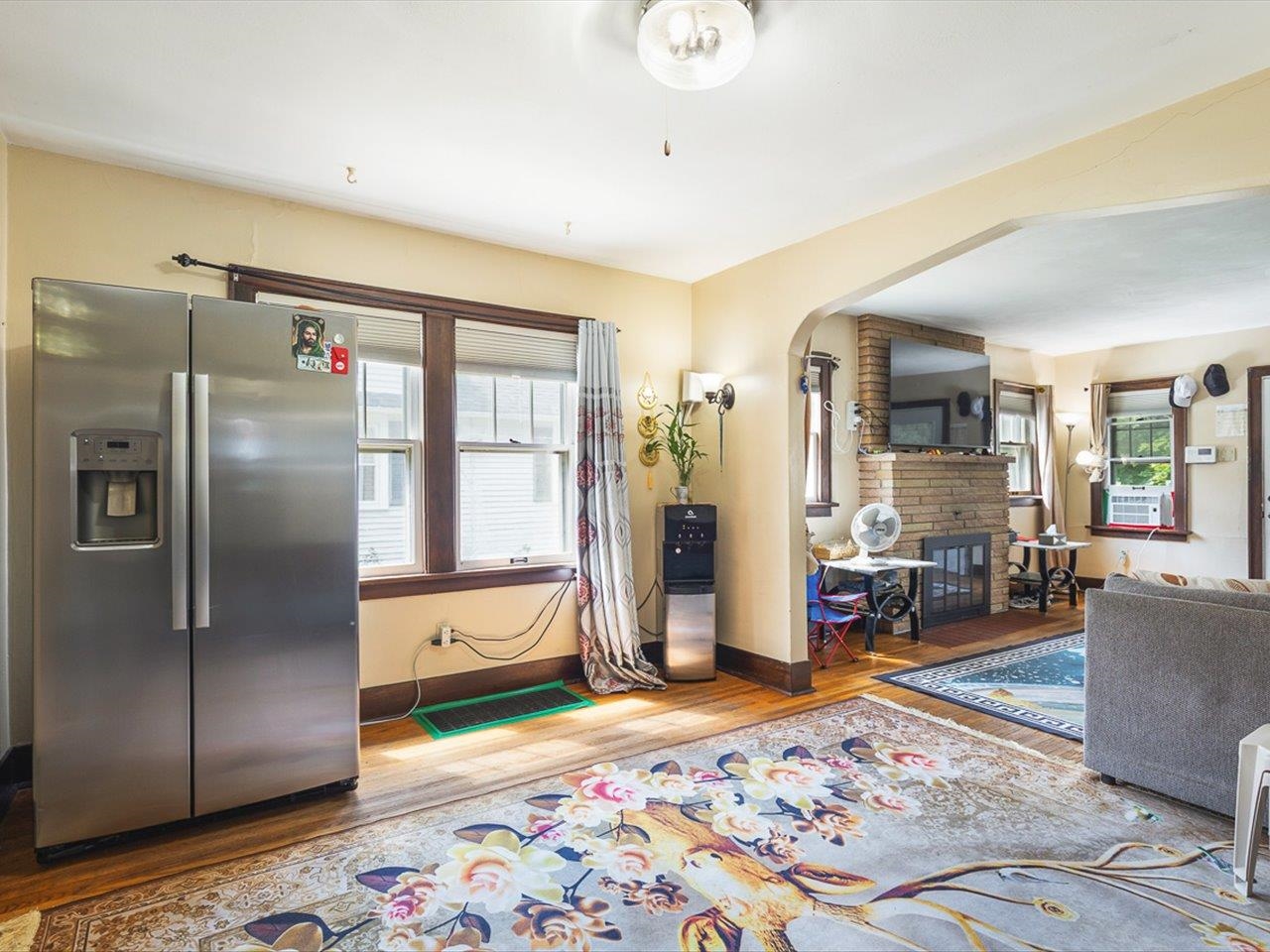 1247 West Logan Street Freeport, IL 61032 - Photo 9 of 34 a living room with stainless steel appliances furniture rug and wooden floor
