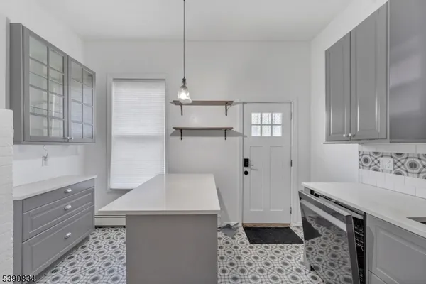 a kitchen with a sink stove and refrigerator