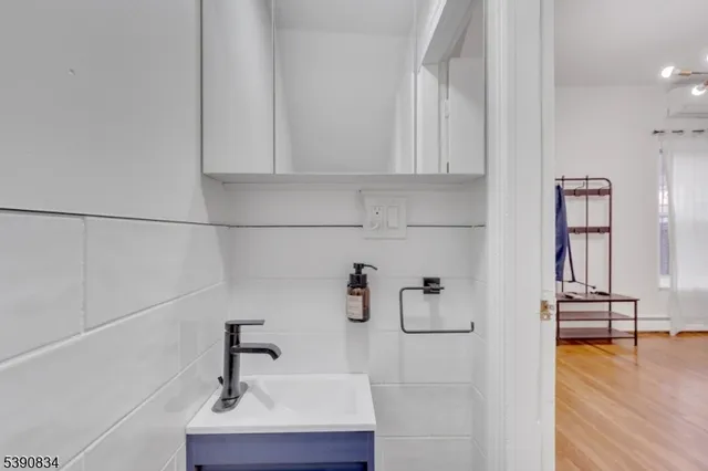 a view of hallway with cabinets