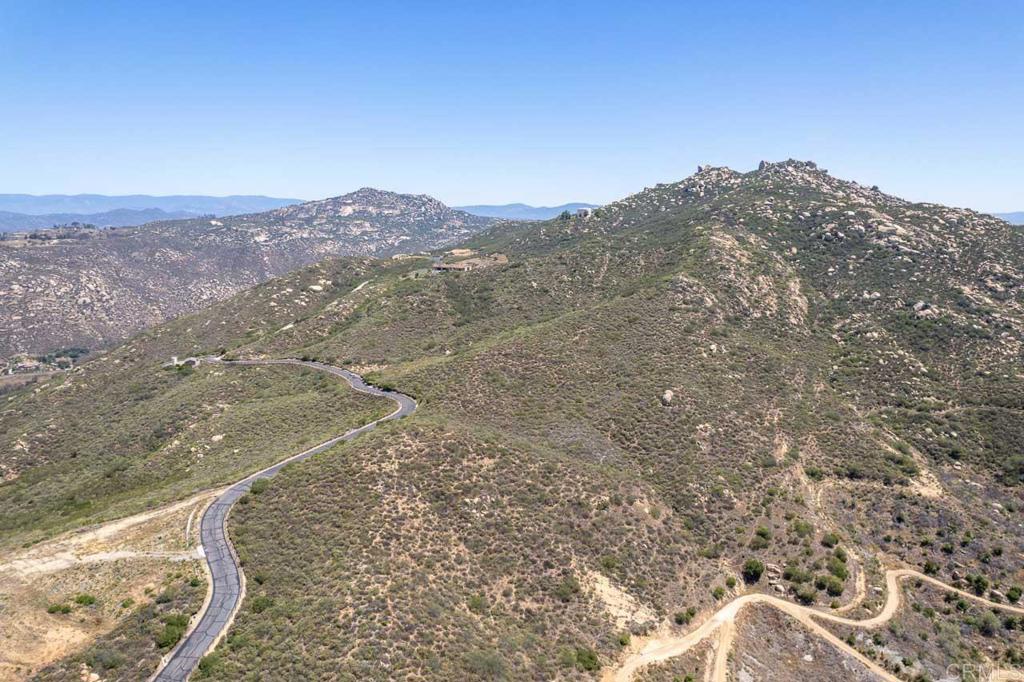 18055 Sunset Point Poway, CA 92064 - Photo 8 of 39 a view of a mountain in the distance in a field