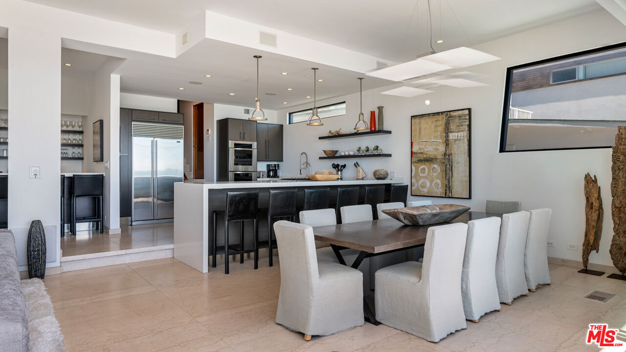 25250 Malibu Road Malibu, CA 90265 - Photo 25 of 66 a large kitchen with a table and chairs