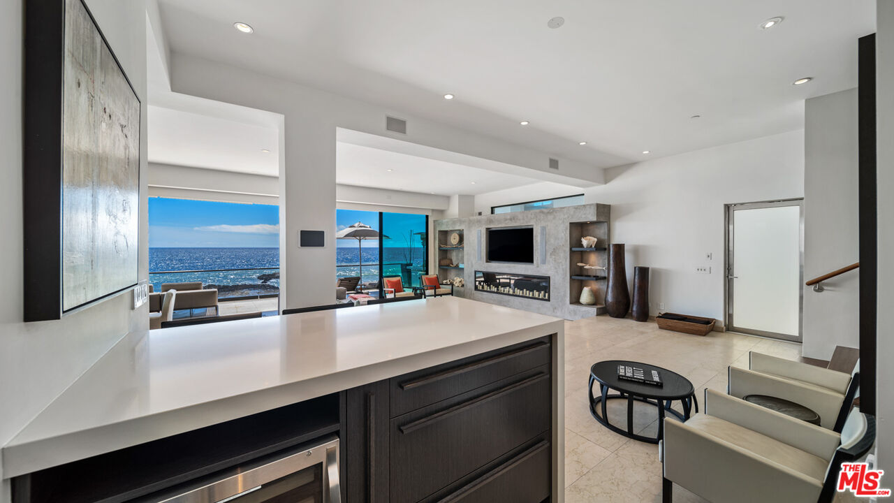 25250 Malibu Road Malibu, CA 90265 - Photo 26 of 66 a kitchen with sink cabinets and appliances