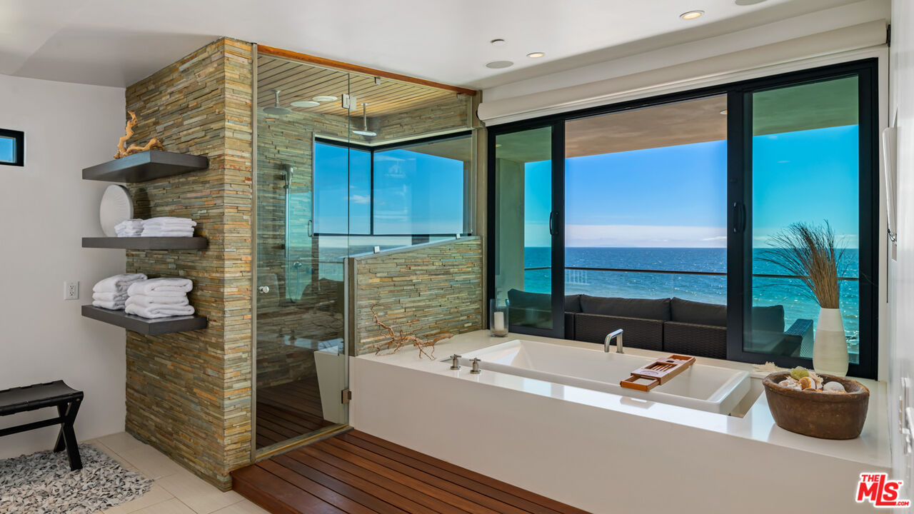 25250 Malibu Road Malibu, CA 90265 - Photo 39 of 66 a bathroom with a tub and a shower