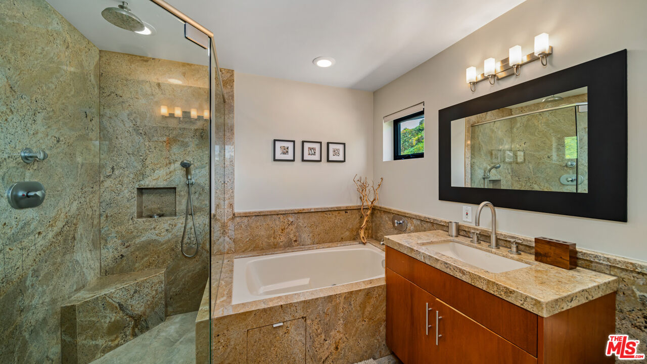 25250 Malibu Road Malibu, CA 90265 - Photo 52 of 66 a bathroom with a tub sink and mirror