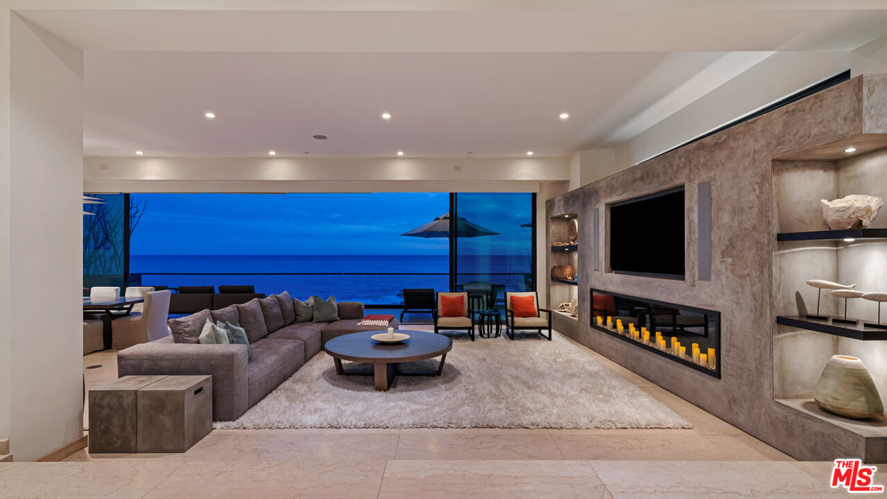 25250 Malibu Road Malibu, CA 90265 - Photo 6 of 66 a living room with furniture and a flat screen tv
