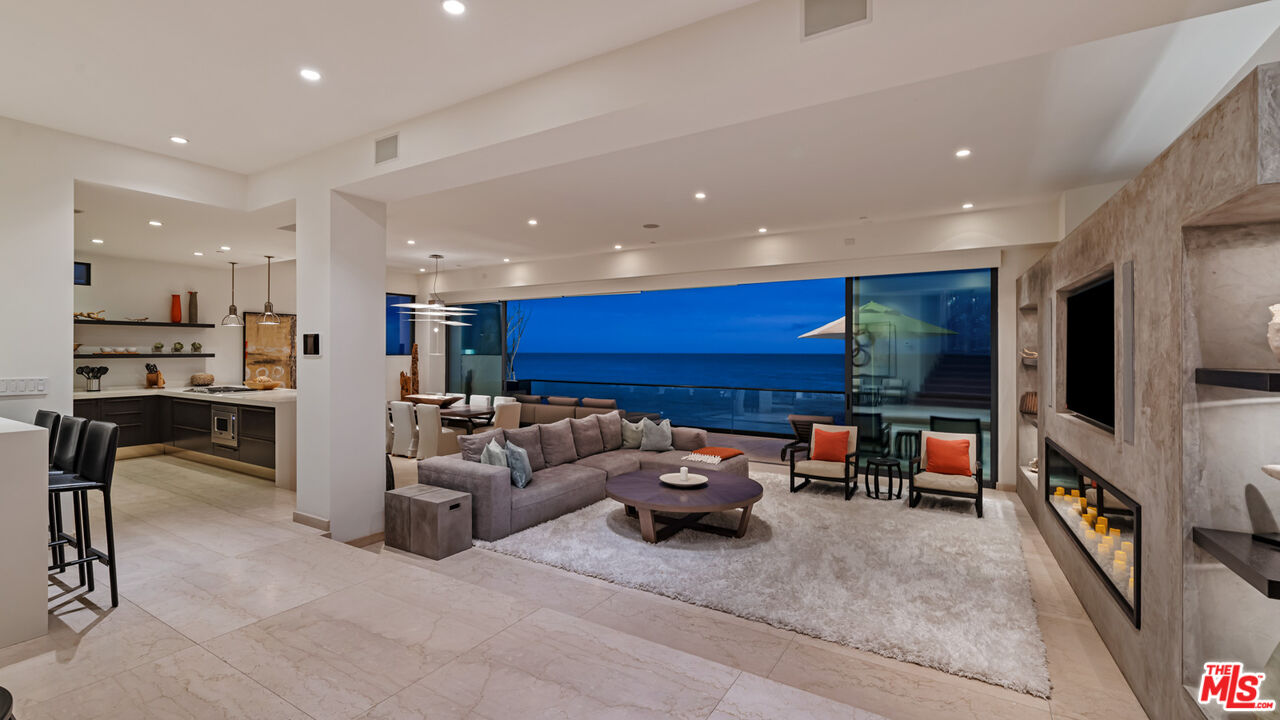 25250 Malibu Road Malibu, CA 90265 - Photo 10 of 66 a living room with furniture and a flat screen tv