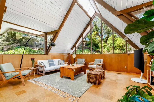 a outdoor living space with furniture and a fireplace