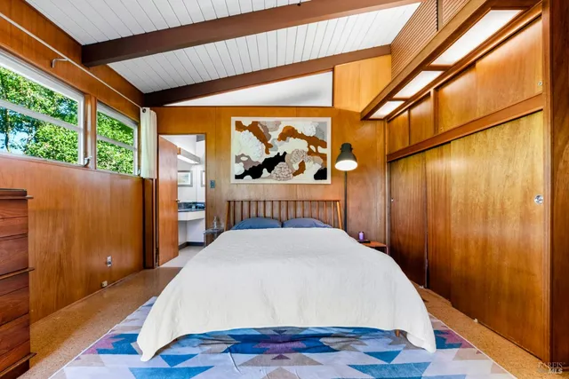 a bathroom with a sink a bathtub and a double vanity sink