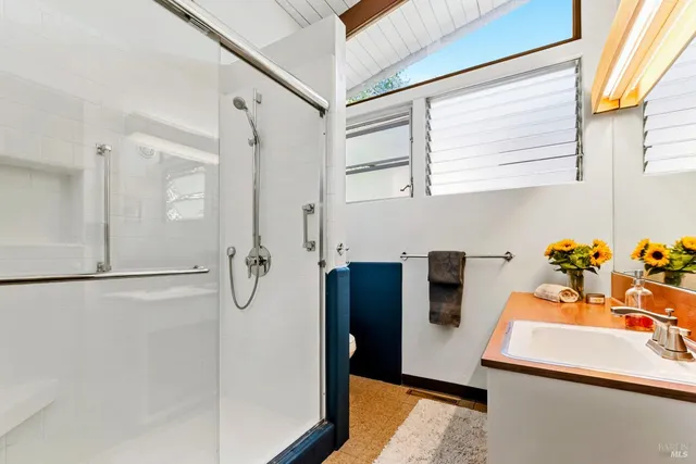a view of a living room with a washer and dryer