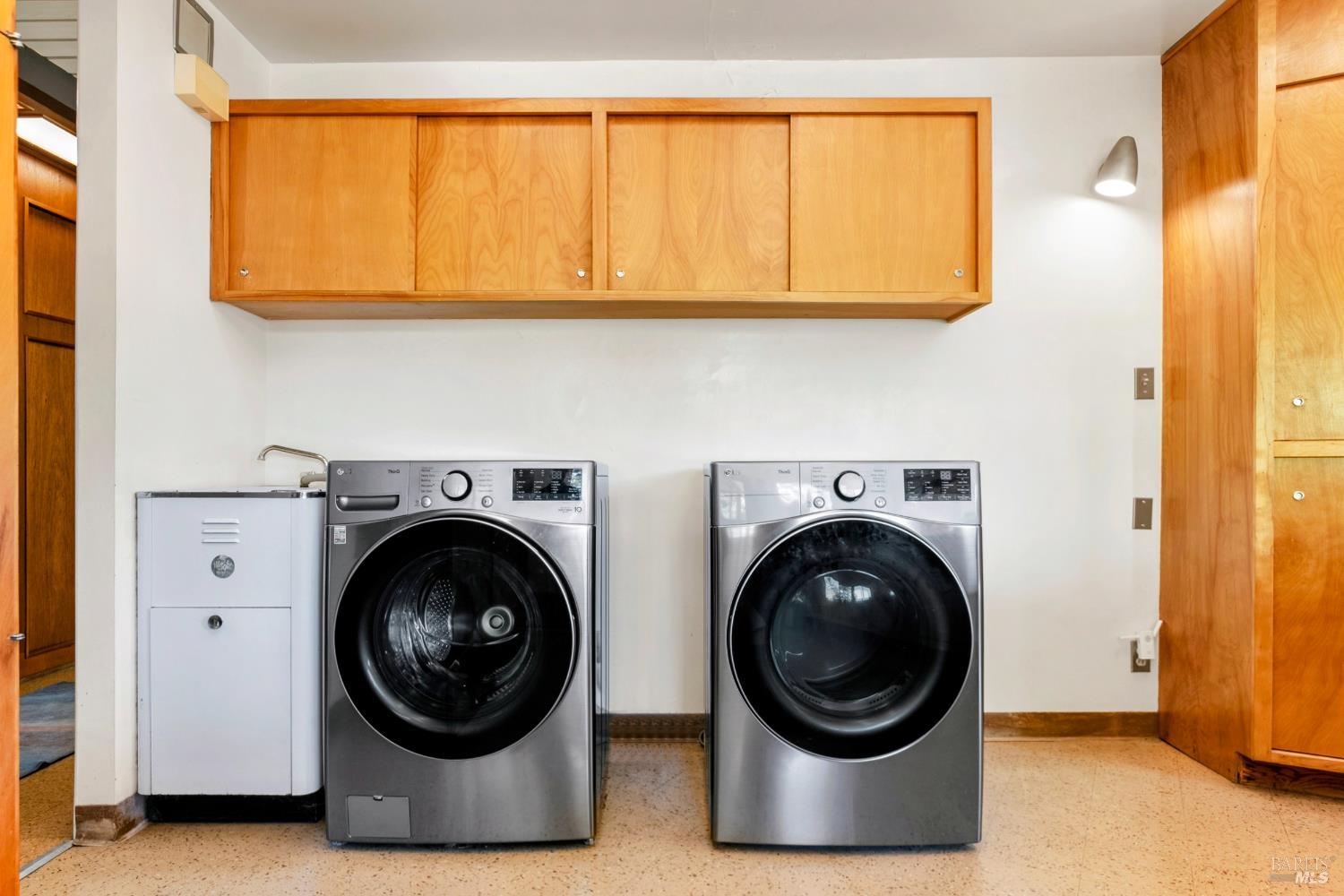 2140 Hyland Court Santa Rosa, CA 95404 - Photo 39 of 51 a view of a living room with a washer and dryer