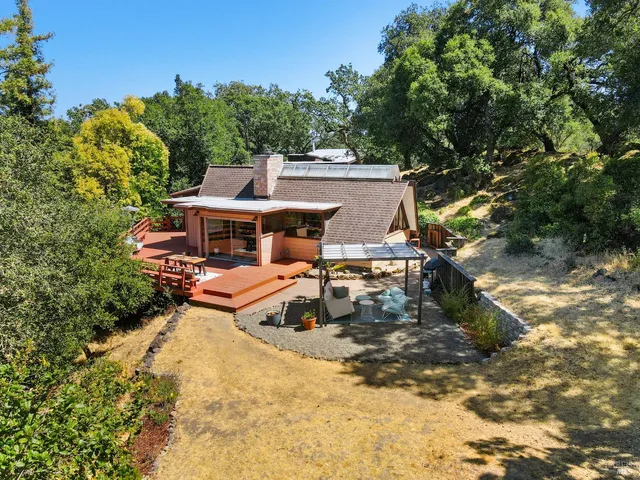 an aerial view of a houses with outdoor space