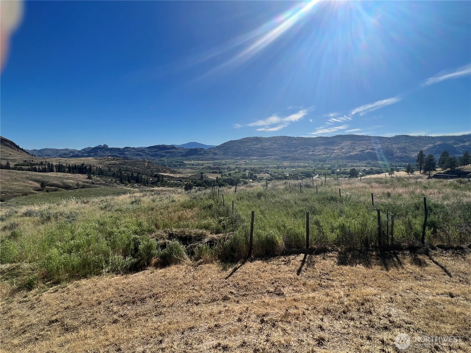 105 Swanson Mill Road Oroville, WA 98844 - Photo 20 of 37 a view of a lake with a mountain in the background