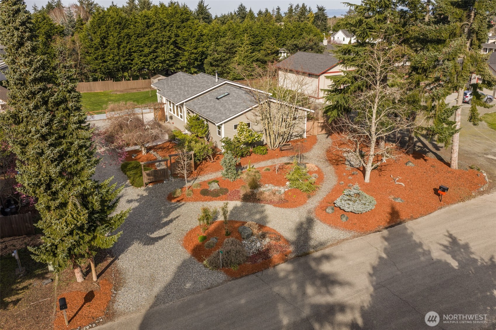 an aerial view of a house with a yard