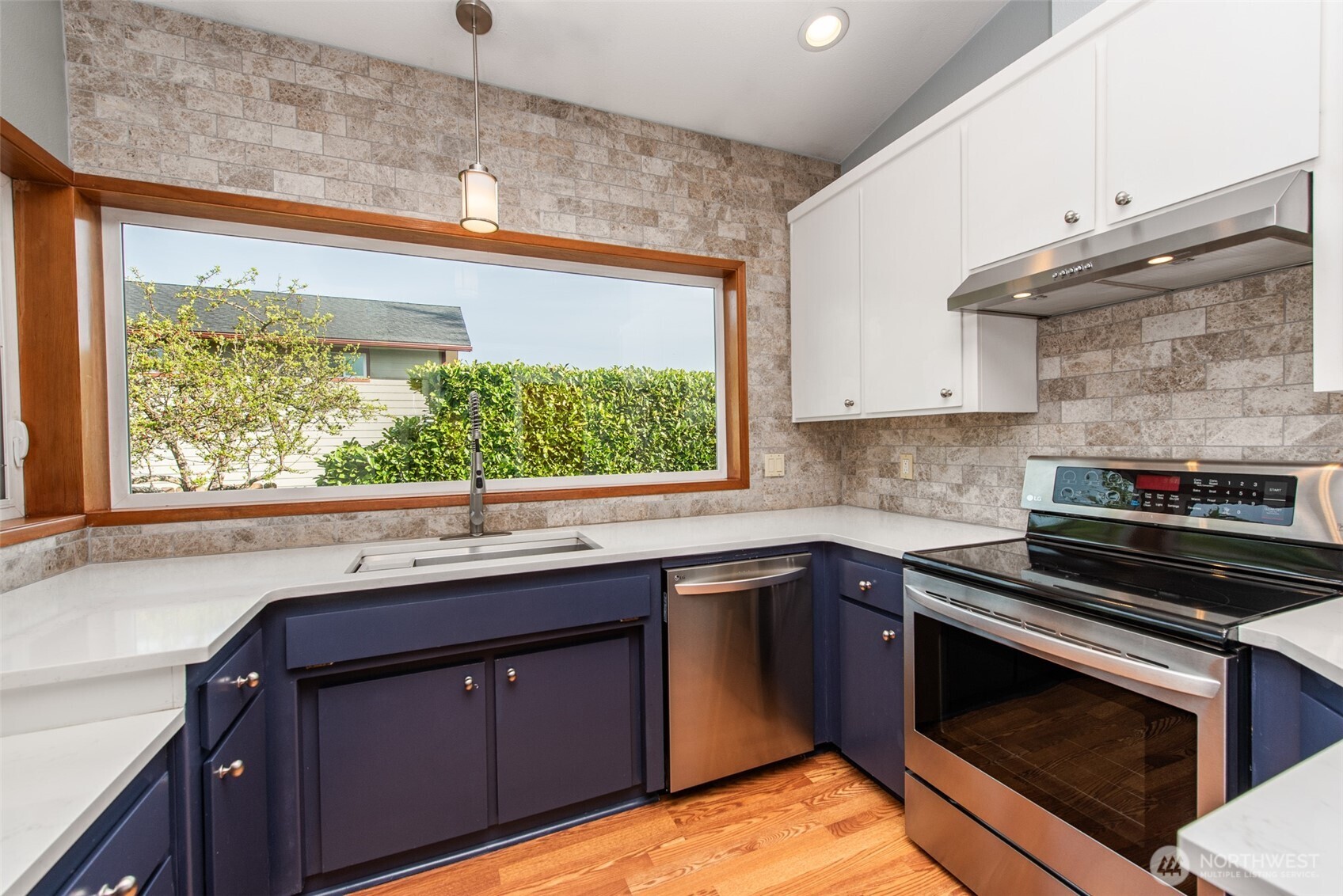 151 Nicole Place Sequim, WA 98382 - Photo 15 of 40 a kitchen with wooden cabinets and a stove top oven