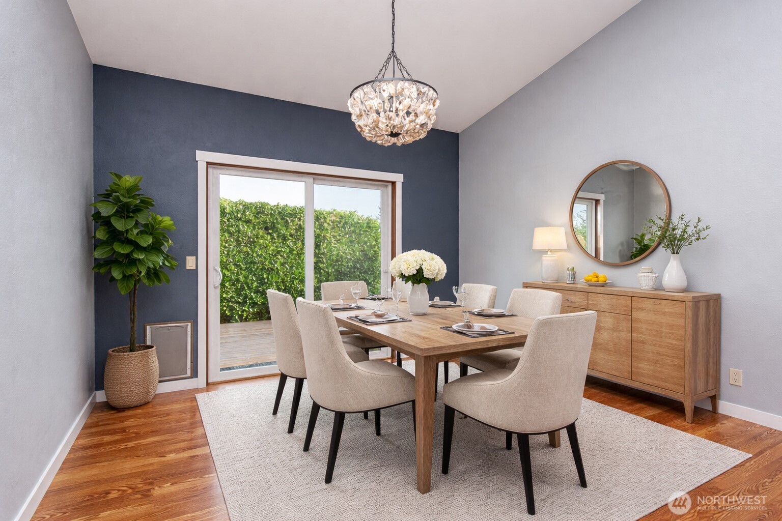 151 Nicole Place Sequim, WA 98382 - Photo 16 of 40 a dining room with furniture a potted plant and a rug