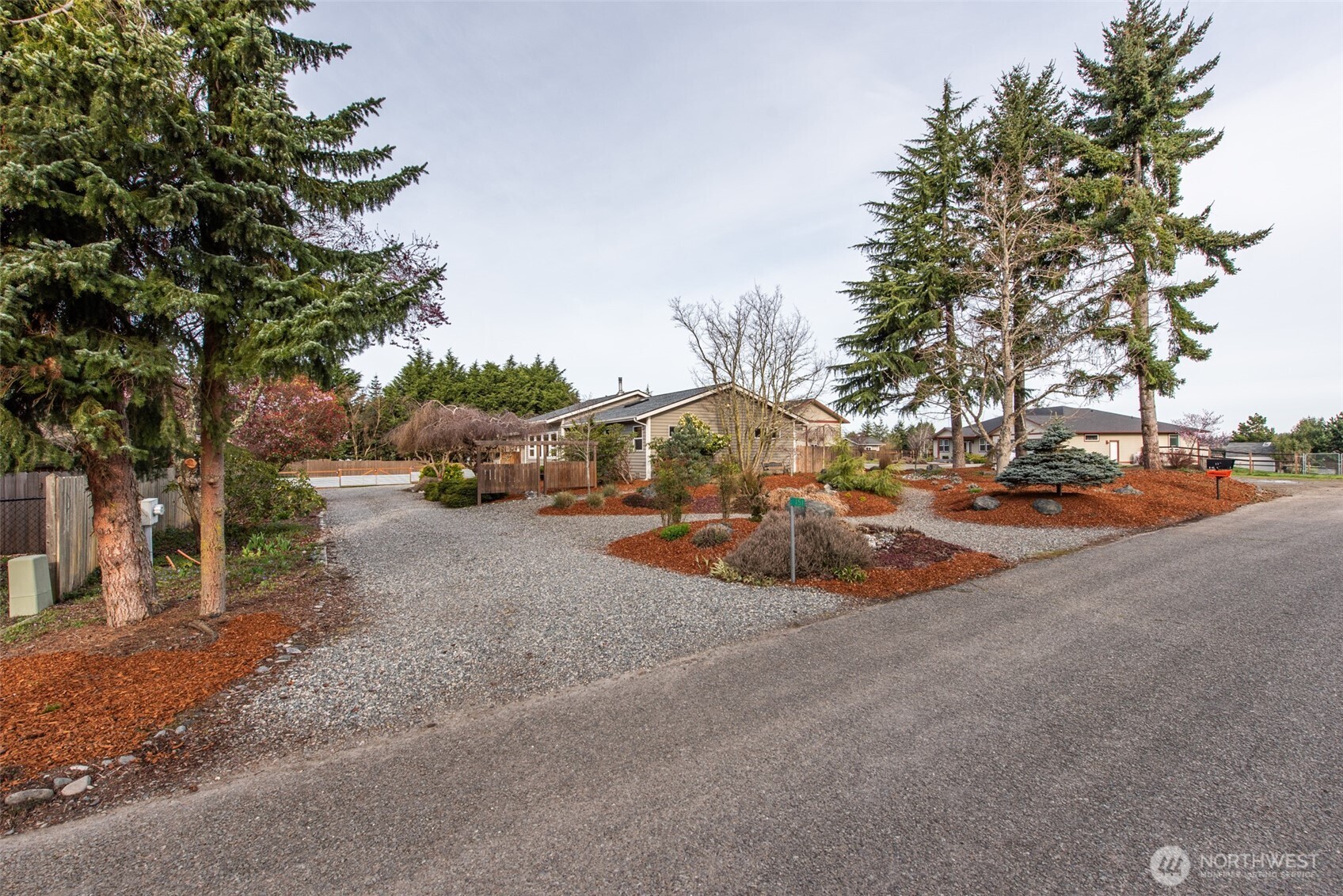 151 Nicole Place Sequim, WA 98382 - Photo 2 of 40 a view of outdoor space with garden and trees