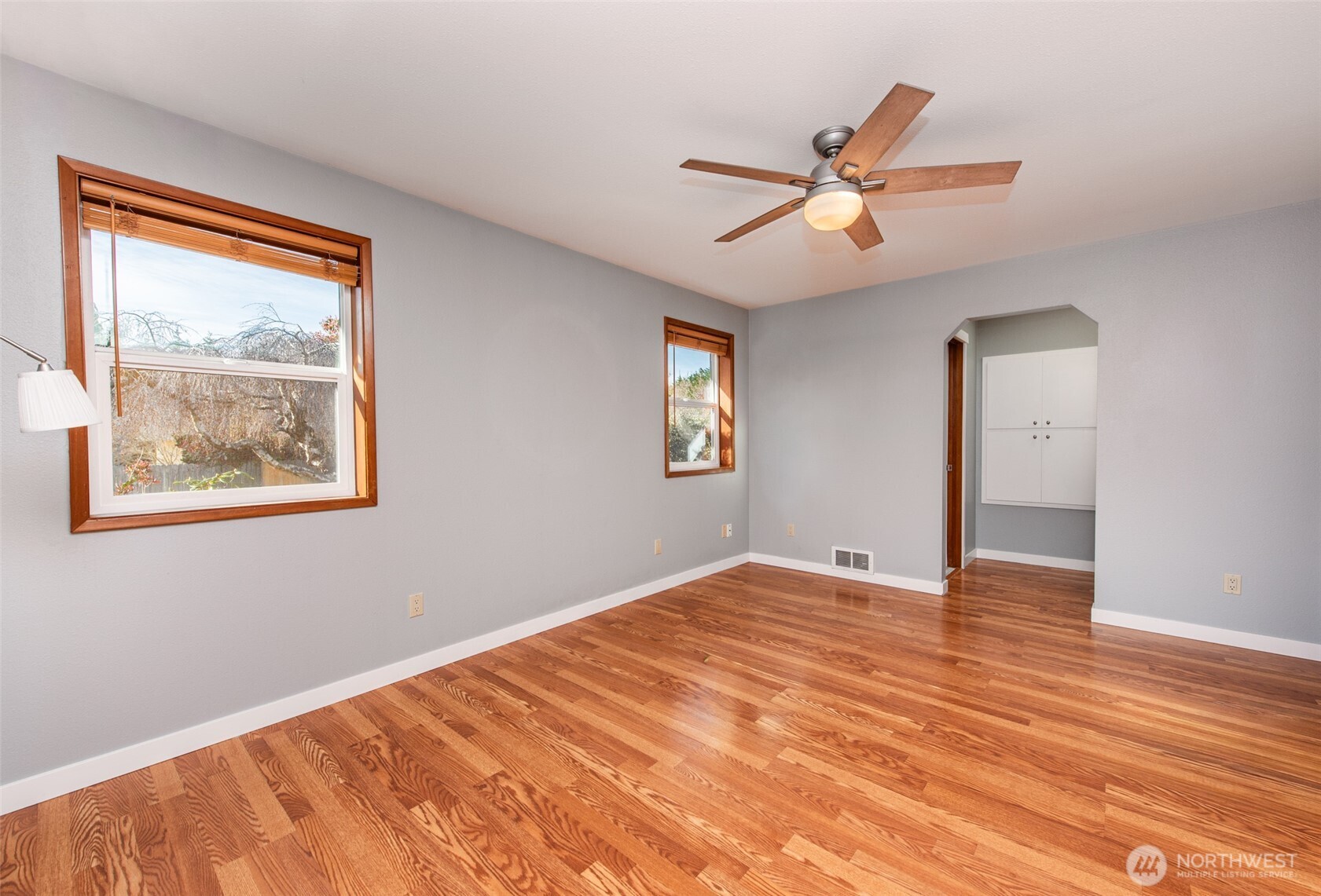 151 Nicole Place Sequim, WA 98382 - Photo 22 of 40 a view of an empty room with window and wooden floor